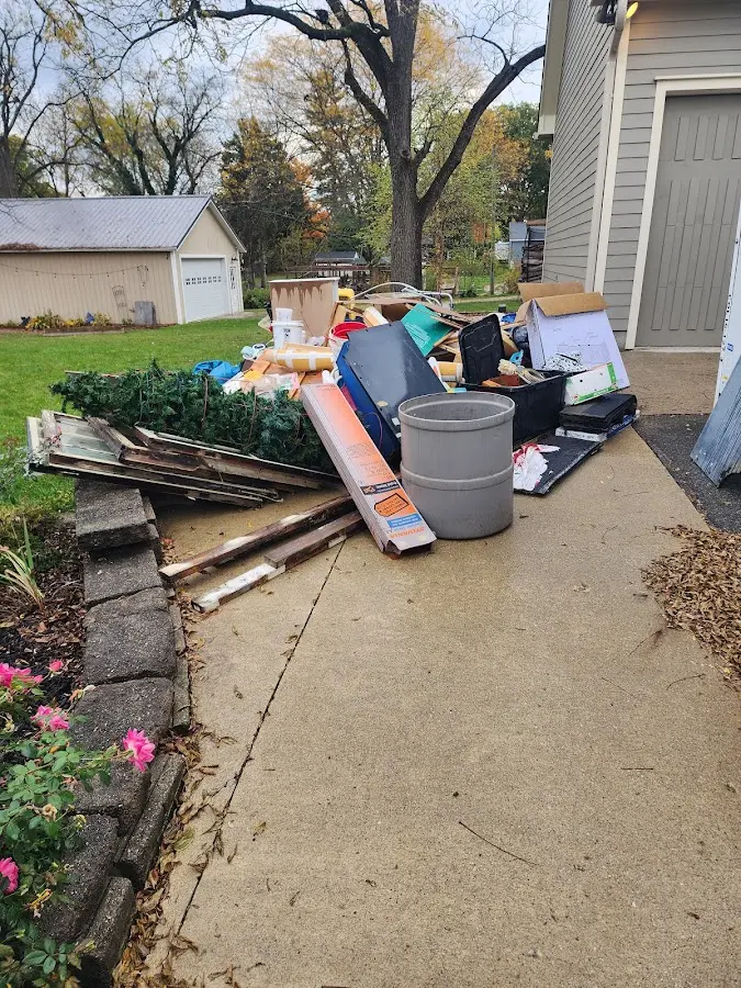 Dumpster being loaded with debris for 10 Yard Dumpster Rental in Elko New Market
